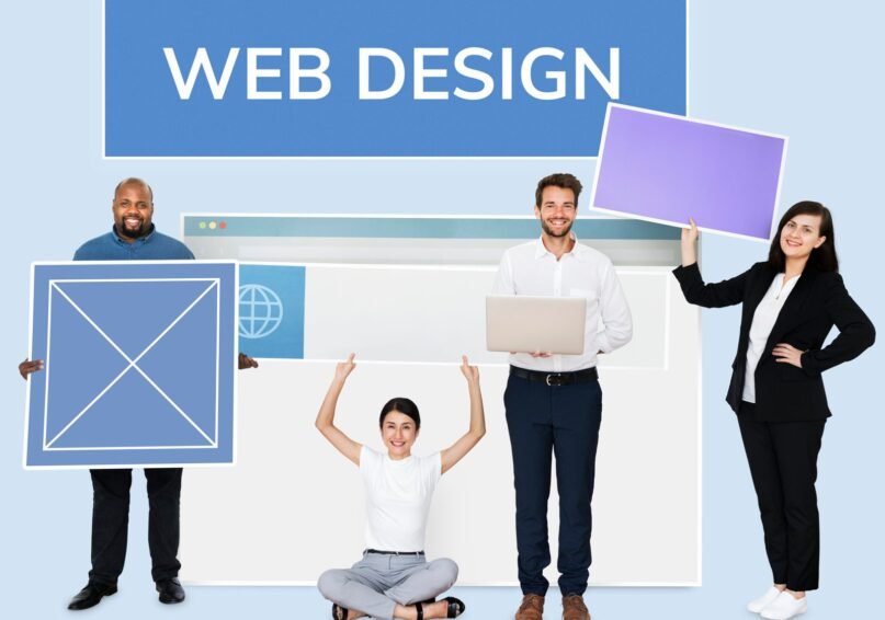 happy-diverse-people-holding-wed-design-board-scaled.jpg